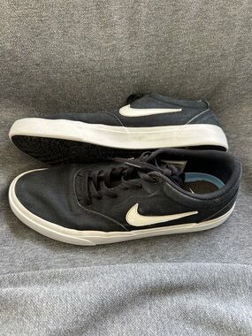 Nike Men’s Black Sneakers with White Swoosh Accent